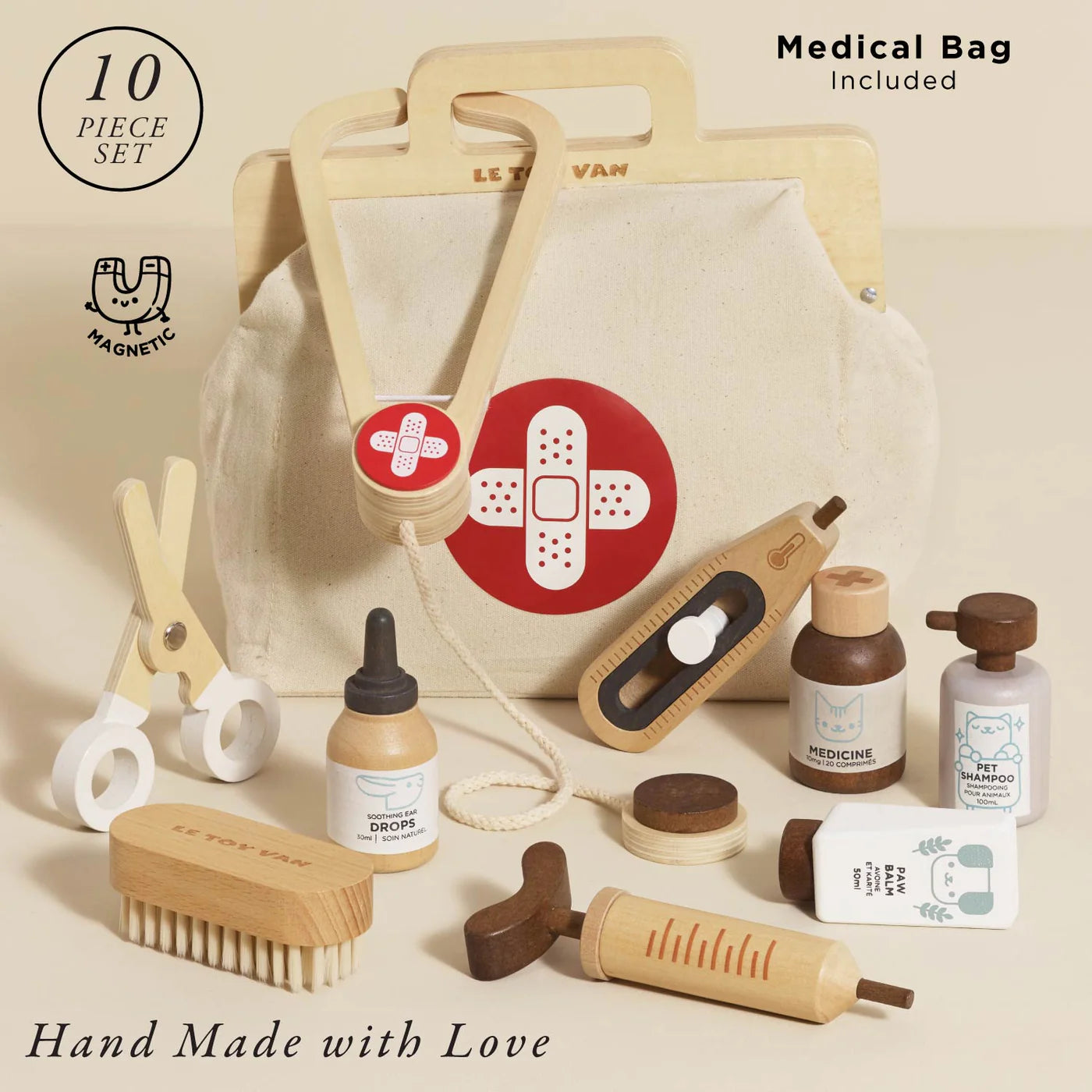 Set of baby care items with a medical bag on a beige background
