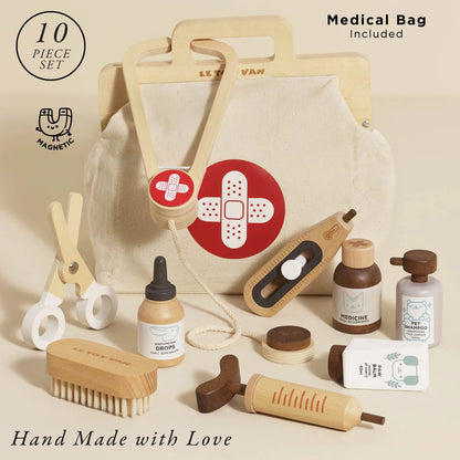 Set of baby care items with a medical bag on a beige background