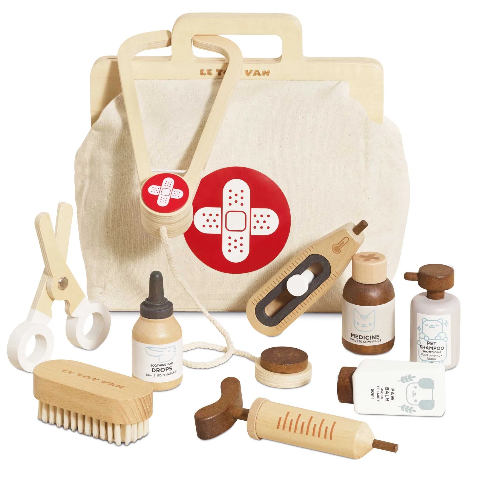 Set of wooden and fabric pet grooming tools with a canvas bag featuring a bandage design.
