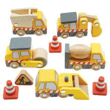 Set of wooden toy construction vehicles on a white background