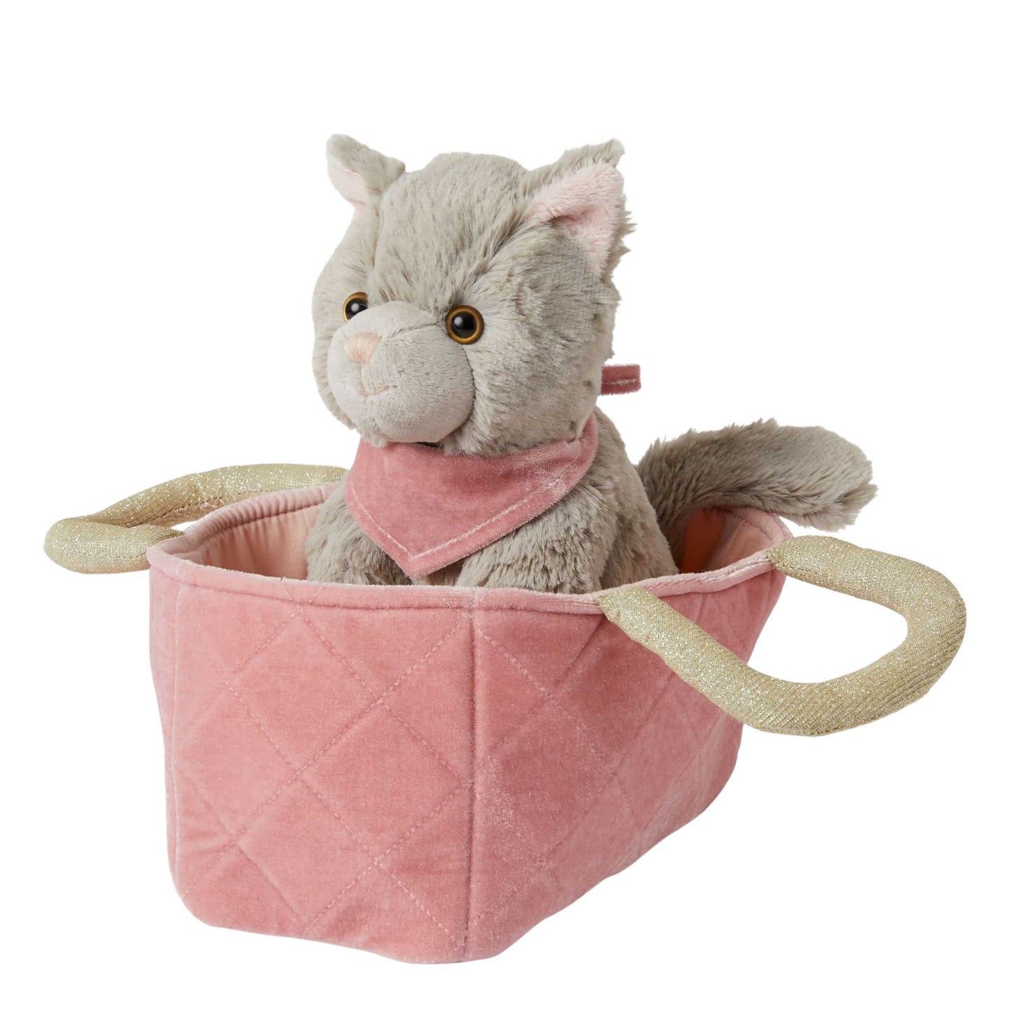 A plush grey kitten toy with a pink velvet bandana sitting in a pink velvet quilted carry basket with beige fabric handles.