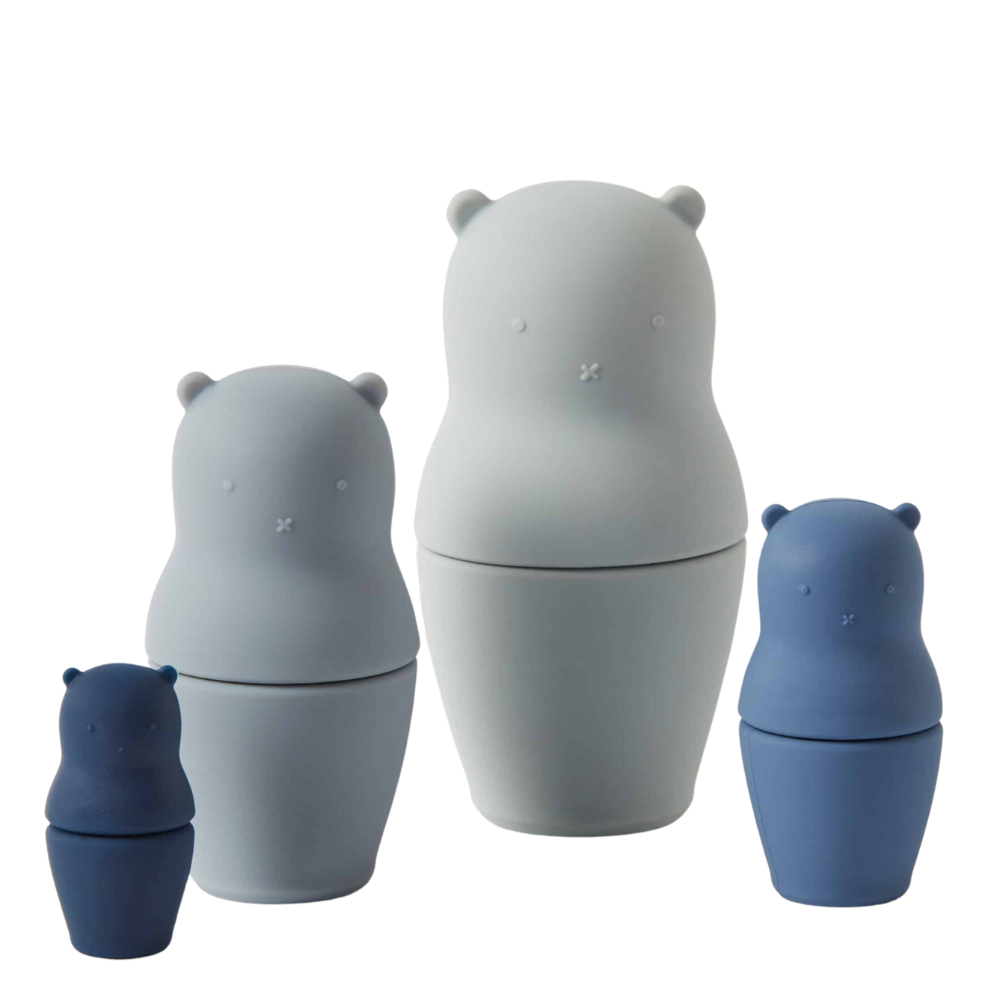 A set of bear nesting dolls in shades of blue and gray, with each doll designed to nest inside the next larger one.