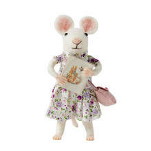 Handmade wool felt mouse in a floral dress holding a book, designed as a decorative toy.
