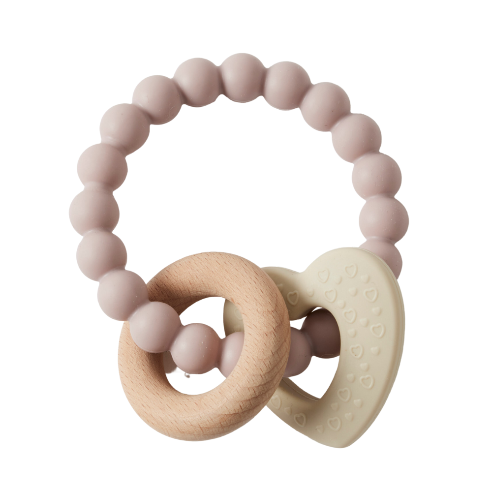 A silicone and wood teether designed in the shape of a heart, with a series of round silicone beads and a wooden ring.