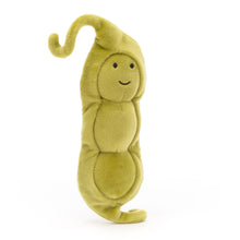 A plush toy resembling a green pea in a pod, with a friendly face and a curly tail.