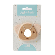 Wooden koala shaped tether toy with apricot silicone ears, attached to cardboard backing card