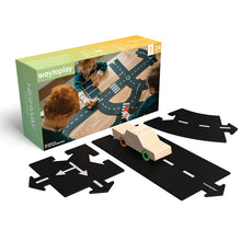 Childs road track toy set including 24 road segments and a wooden car with colored wheels.