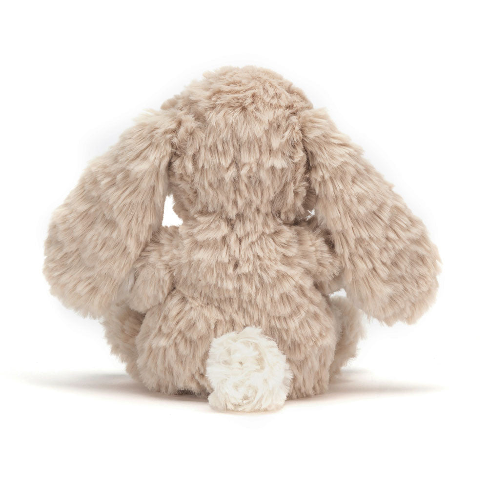 Plush bunny toy on a white background