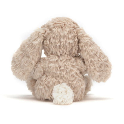 Plush bunny toy on a white background