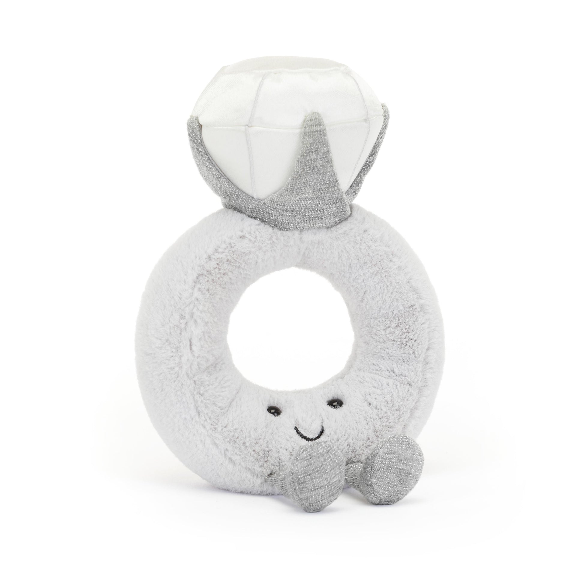 A gray plush toy in the shape of a ring with a diamond-shaped face and a smile.