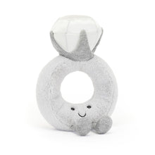 A gray plush toy in the shape of a ring with a diamond-shaped face and a smile.