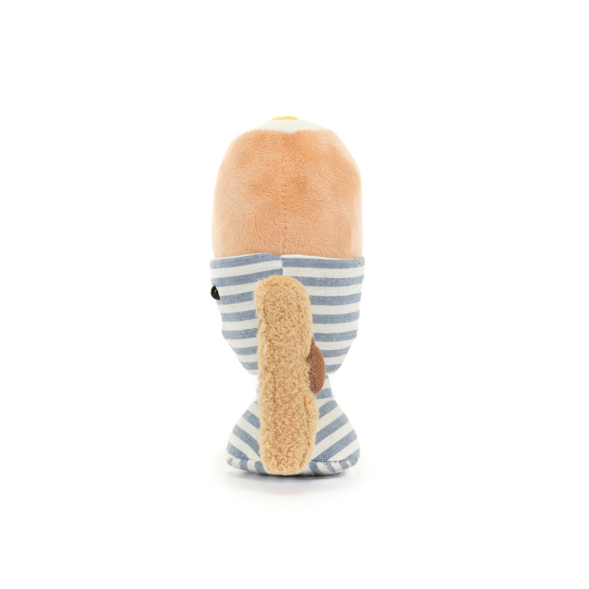 A soft toy resembling a dippy egg in a blue and white stripe egg cup with a brown toast soldier.
