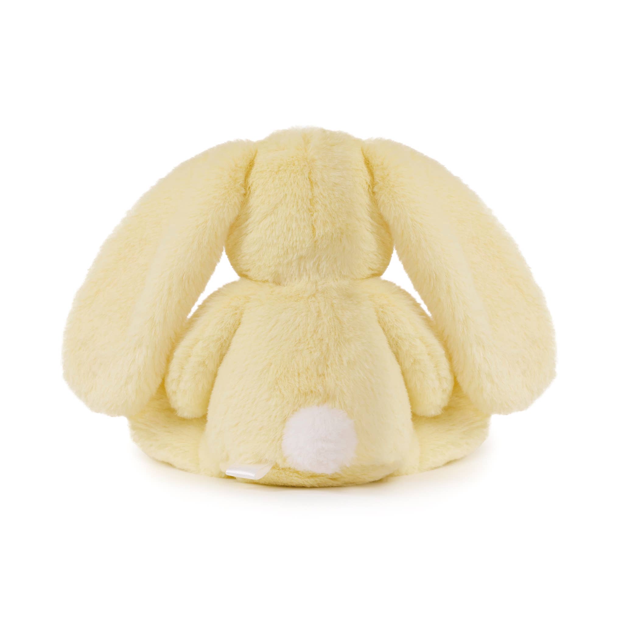 Yellow plush bunny toy on a white background