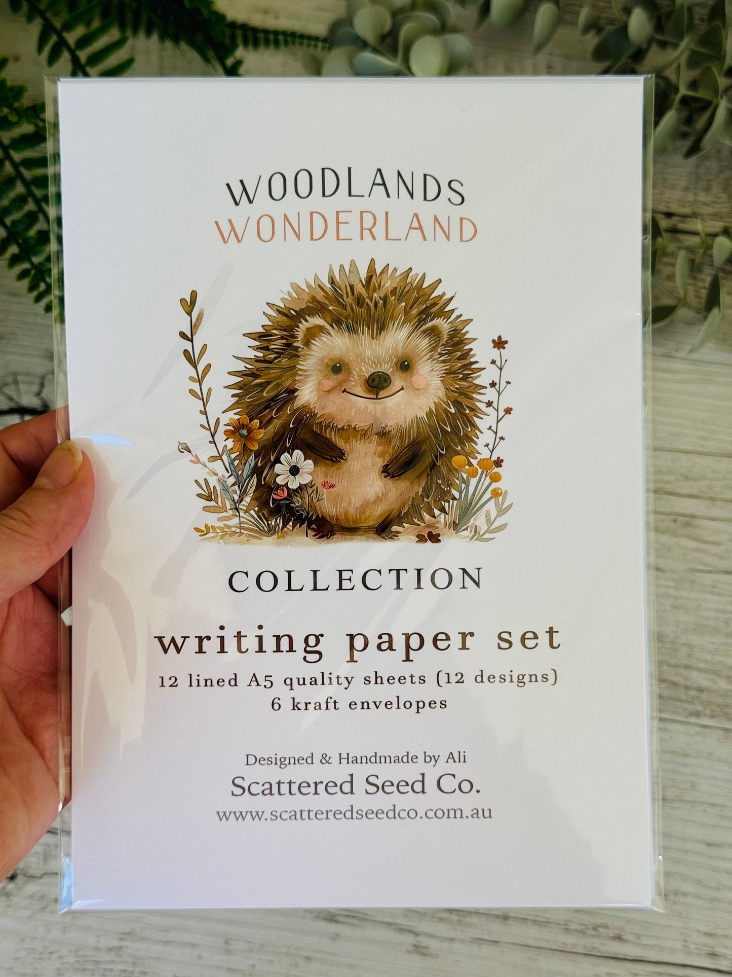 Writing paper set with cute hedgehog illustration.