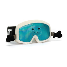 A plush toy ski goggle with a cream suedette frame, holographic aqua lenses, and a smiling face design on the front. It includes a 'Jellycat' band and grey suedette gloves.