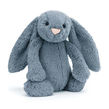 A plush dusky blue bunny with long ears and a soft, fluffy texture.