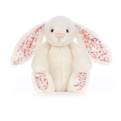 Cream Jellycat bunny stuffed toy with cherry blossom fabric accents on ears and feet