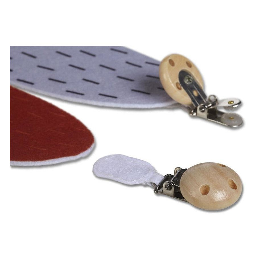 Wooden clips attached to felt shapes on a white background