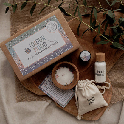 Colour Mood Potion Kit  by the Little Potion Co. - contents displayed on wooden tray and hessian cloth