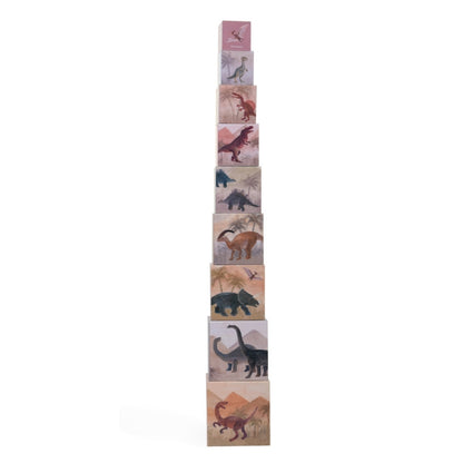 Stack of dinosaur-themed children's blocks on a white background