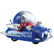Toy space police vehicle with astronaut figure and helmet inset on a white background