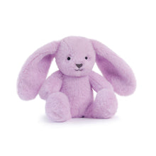 Purple plush bunny toy on a white background