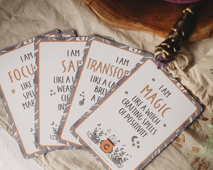 Set of affirmation cards with motivational phrases on a textured surface.