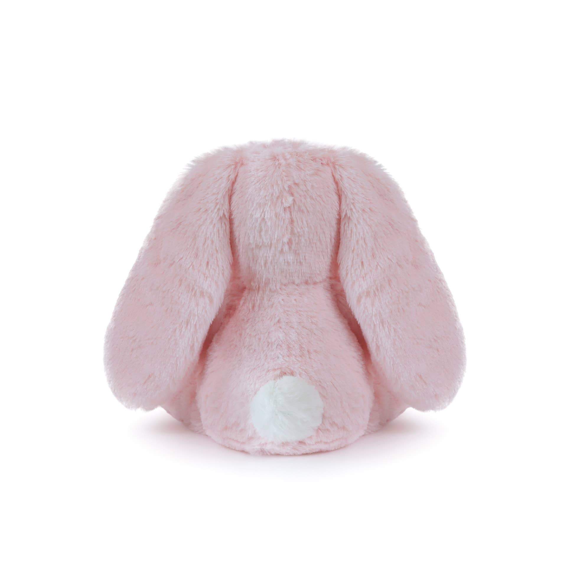 Pink plush bunny tail on a white background