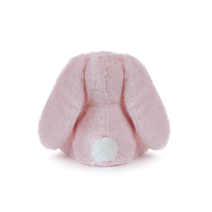 Pink plush bunny tail on a white background
