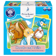 Orchard Toys Peter Rabbit 'Heads and Tails' game packaging with cartoon characters on a blue background.