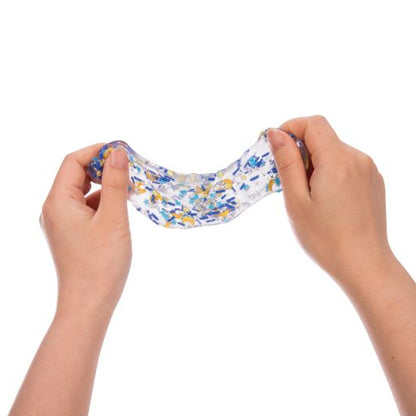 Hands stretching colourful galactic putty against a white background