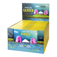 Packaging for Magic Garden crystal growing kit featuring illustrations of trees, mountains, grass, and a crystal garden.