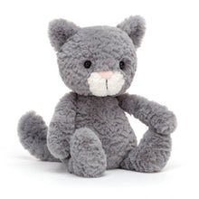 A plush toy resembling a grey kitten with tufty fur, perky ears, and a pink nose.