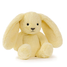 Yellow plush bunny toy on a white background
