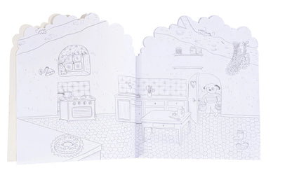 A children's coloring book or activity booklet shown open, featuring a black-and-white line drawing of a cozy kitchen scene with a panda character on the right page.