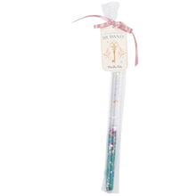 A green magic wand made of plastic/acrylic tube with a clear gel and green glitter, presented in a tulle bag with a satin ribbon.