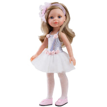 Doll wearing a white dress with pink accents on a white background