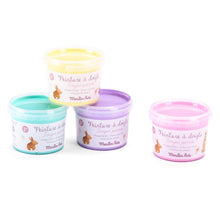 Four tubs of pastel finger paints in yellow, blue, purple, and pink colors, each labeled with the brand name 'Moulin Roty' and illustrations of paint splatters.