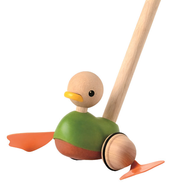 wooden green and orange duck attached to wooden push-along stick