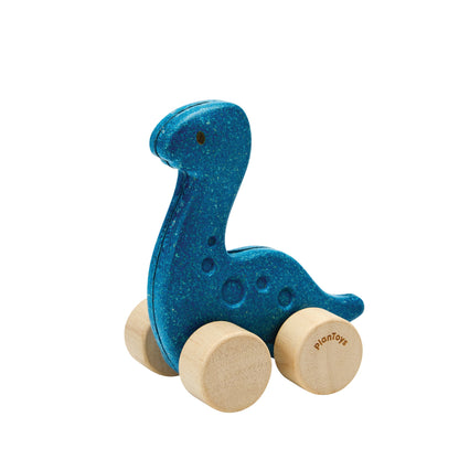 Blue dinosaur-shaped toy with wooden wheels on a white background