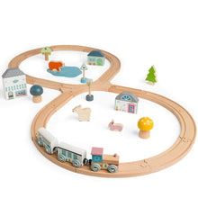 Wooden train set with figure of eight layout, including train cars, tracks, and assorted accessories like a cafe, bakery, trees, and animals.