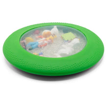 Green sensory discovery toy with colorful beads and farm figurines sealed behind a translucent silicone window.