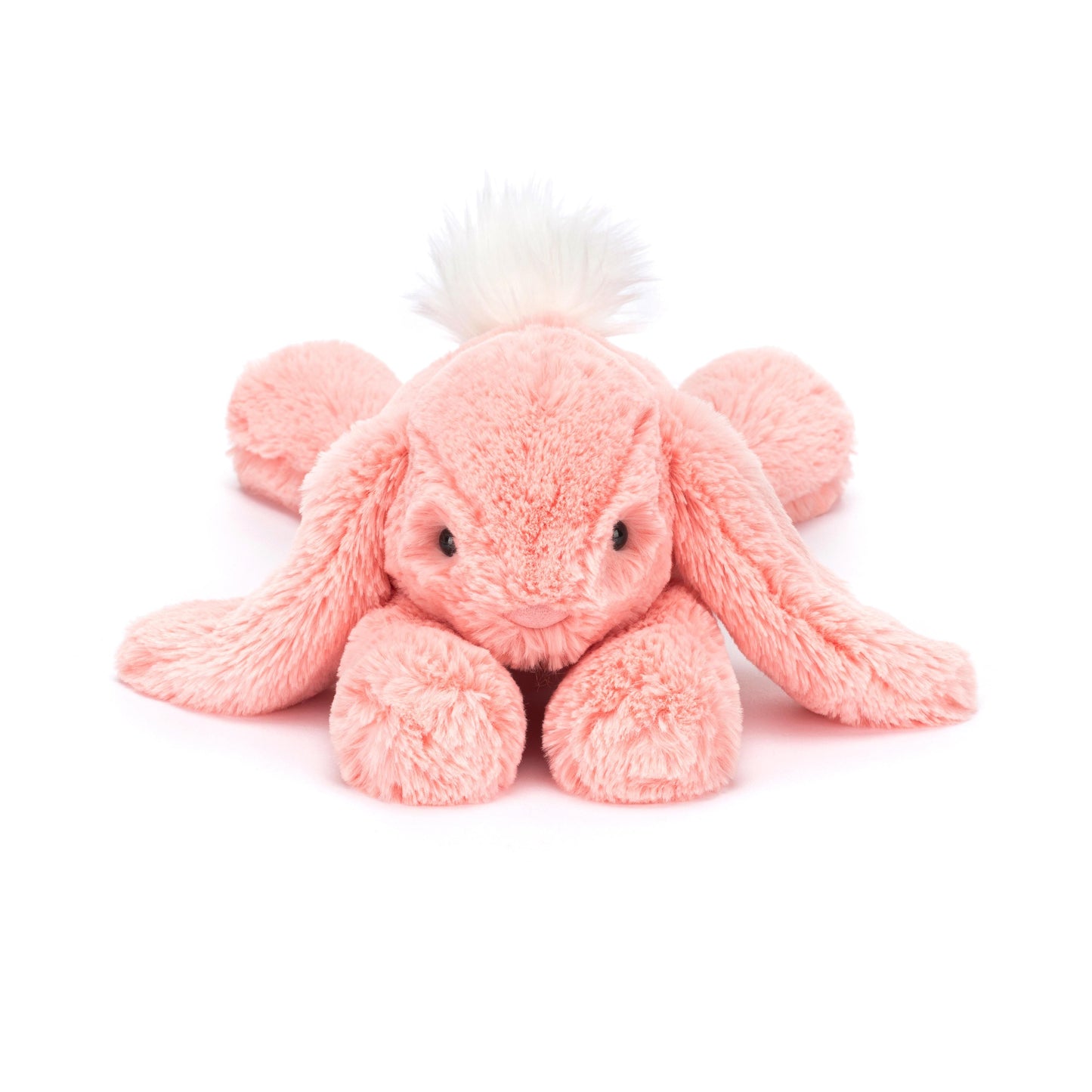 A plush toy resembling a lop-eared bunny in bright apricot fur with a fluffy cream bobtail.