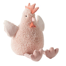 Large pink Plush toy chicken on a light  background