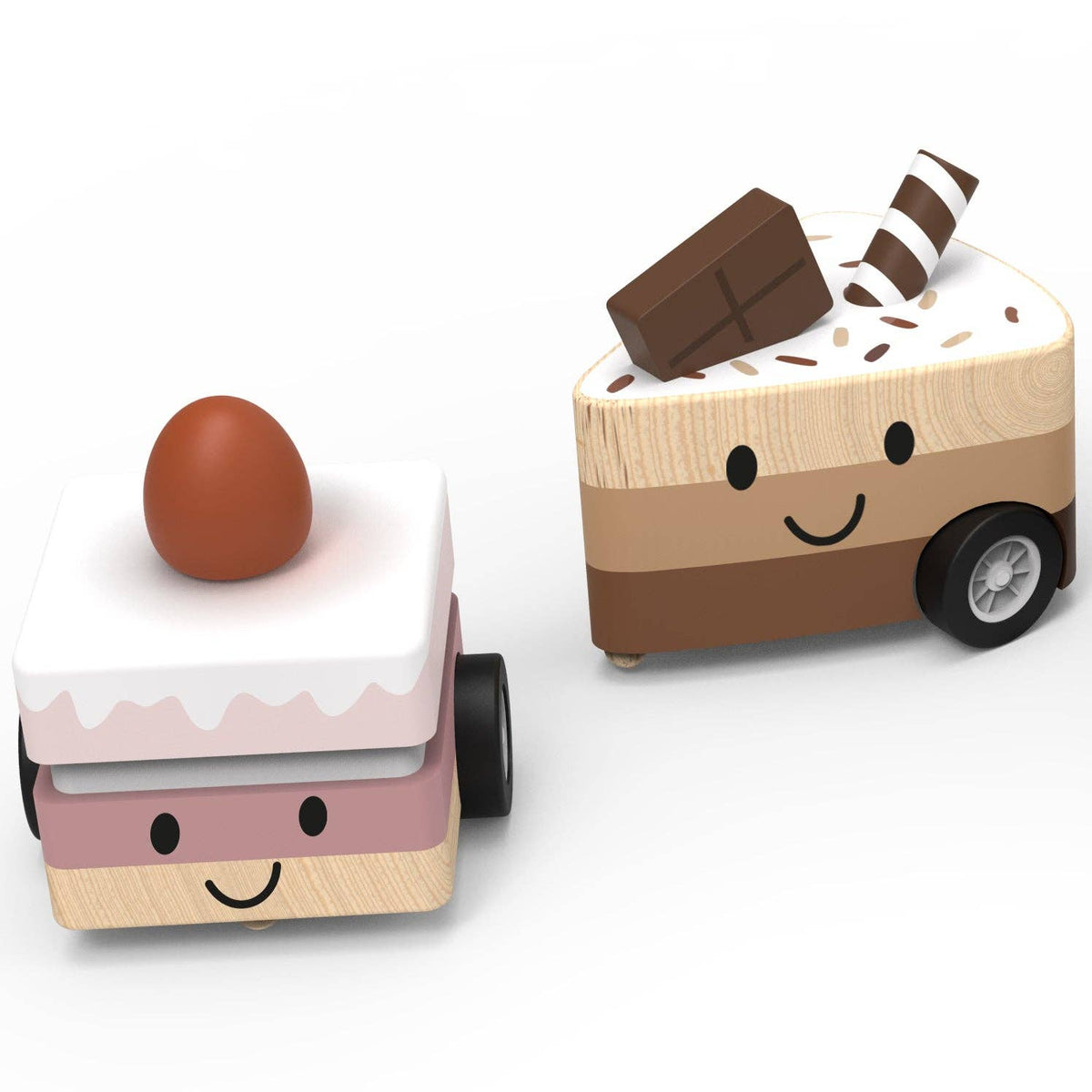 Two wooden toy vehicles shaped like dessert slices, one with a brown egg on top and one with a chocolate bar and striped candy on top, on a white background.