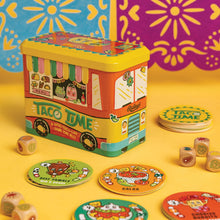 Colorful 'Taco Time' game box with game pieces on a yellow background