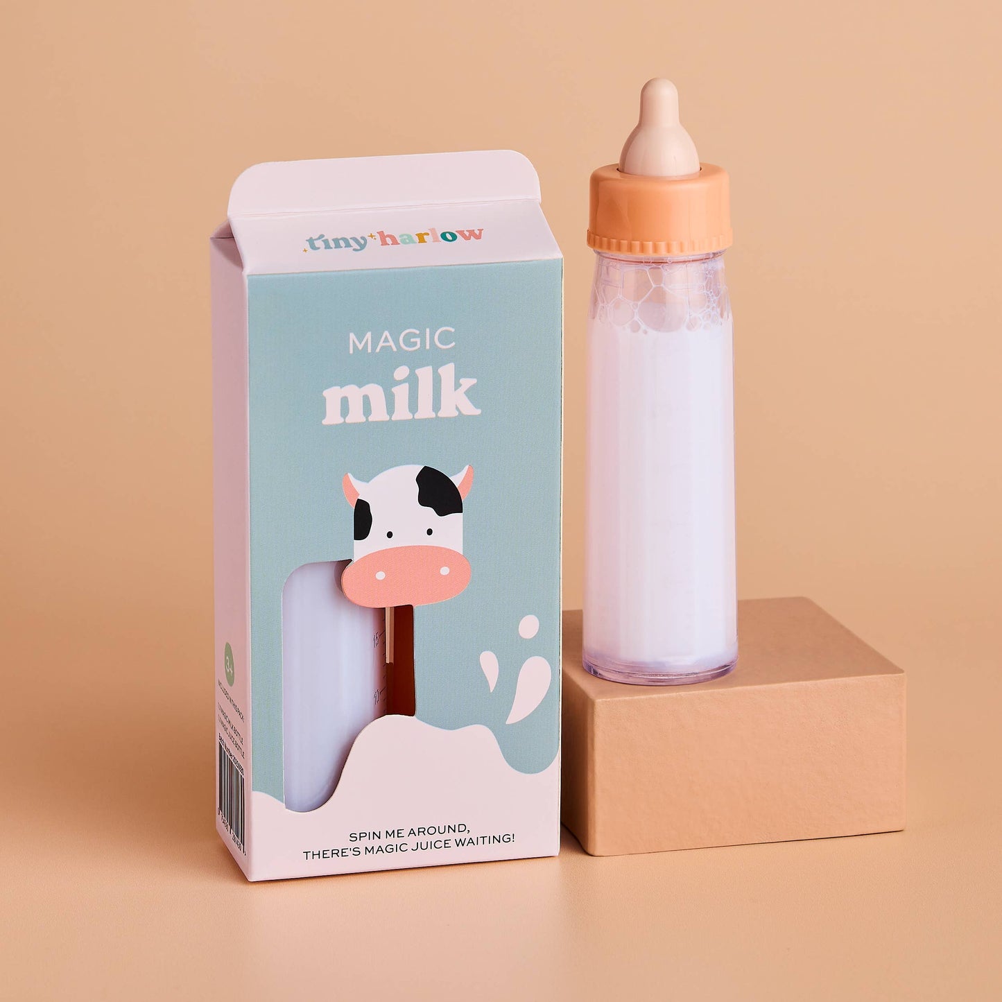 Bottle with 'Magic Milk' packaging featuring a cow illustration on a beige background