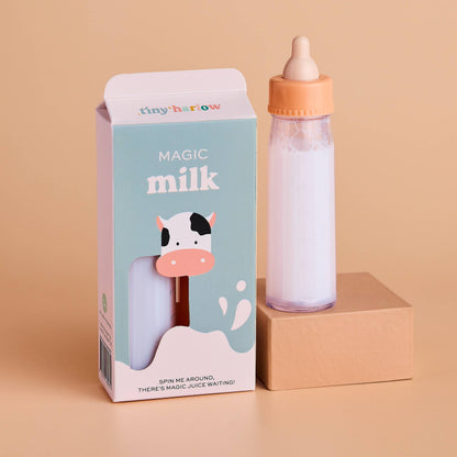 Bottle with 'Magic Milk' packaging featuring a cow illustration on a beige background
