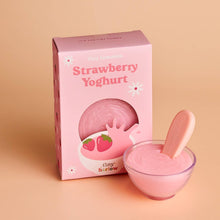 Pink strawberry yoghurt doll pretend play food product with packaging on a beige background