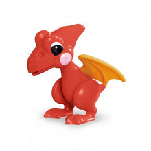 Child's red plastic pterodactyl figure with yellow wings and large black and white eyes.